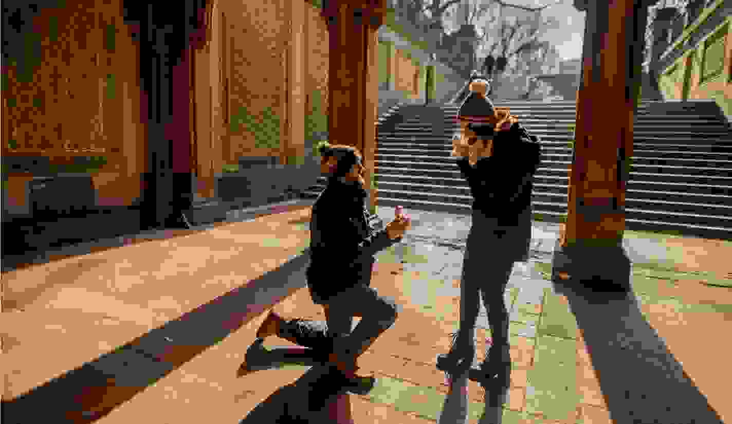 Proposal outside at the bottom of a set of stairs