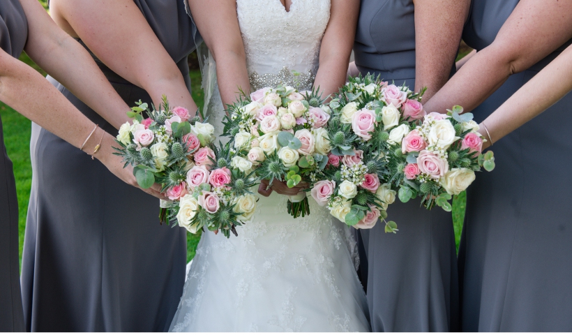 Bride and bridesmaids with flowers