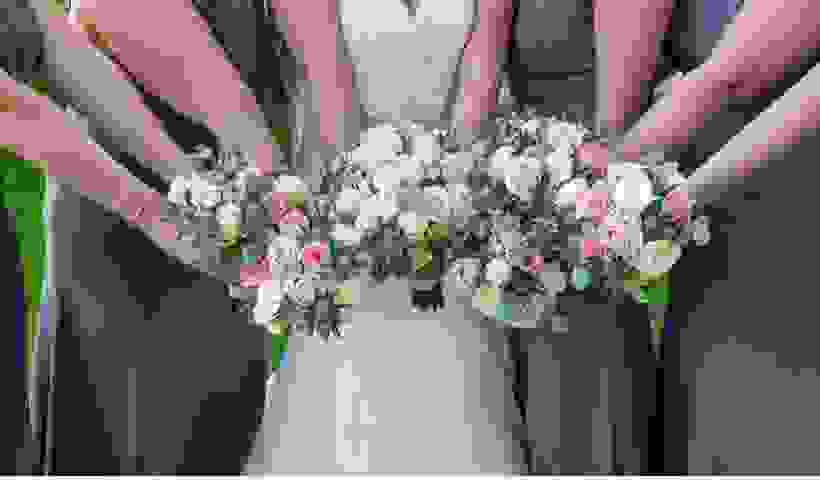 Bride and bridesmaids with flowers