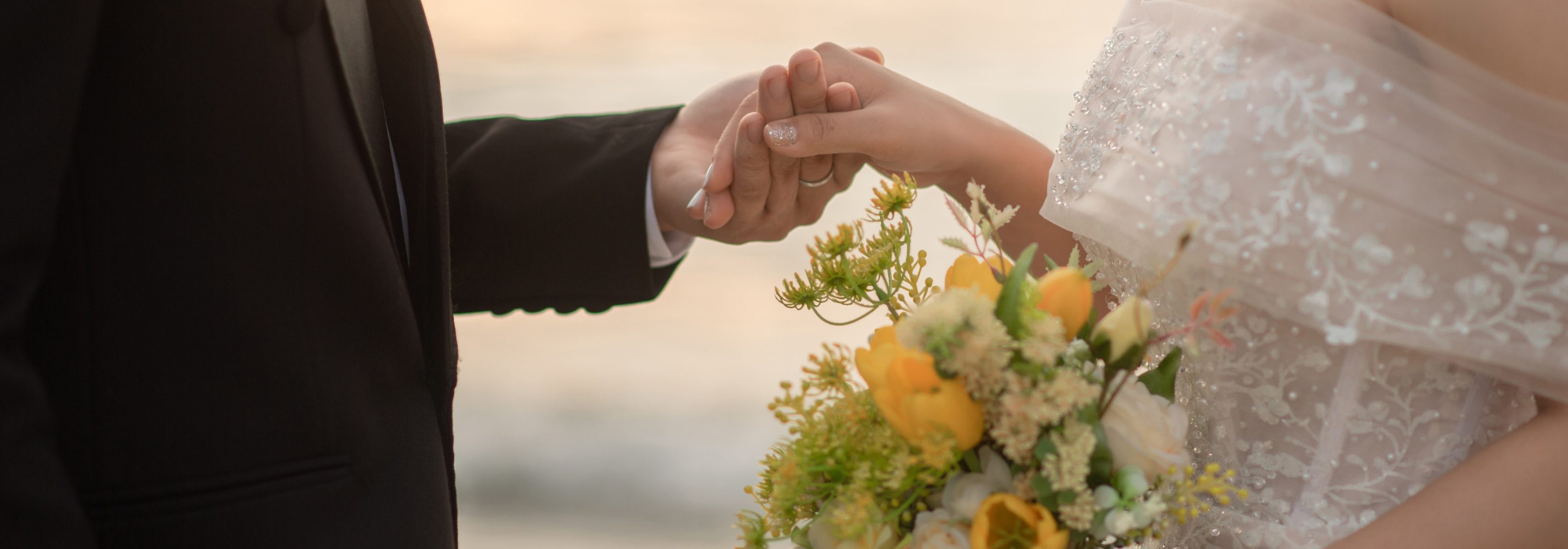 Married couple holding hands