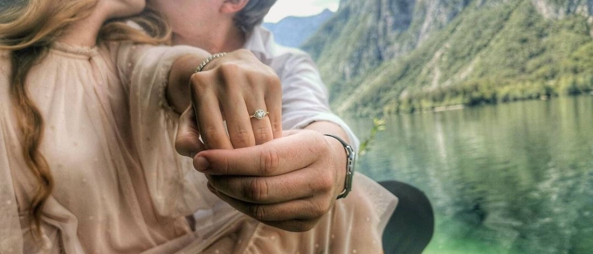 Engaged couple on a boat in a lake
