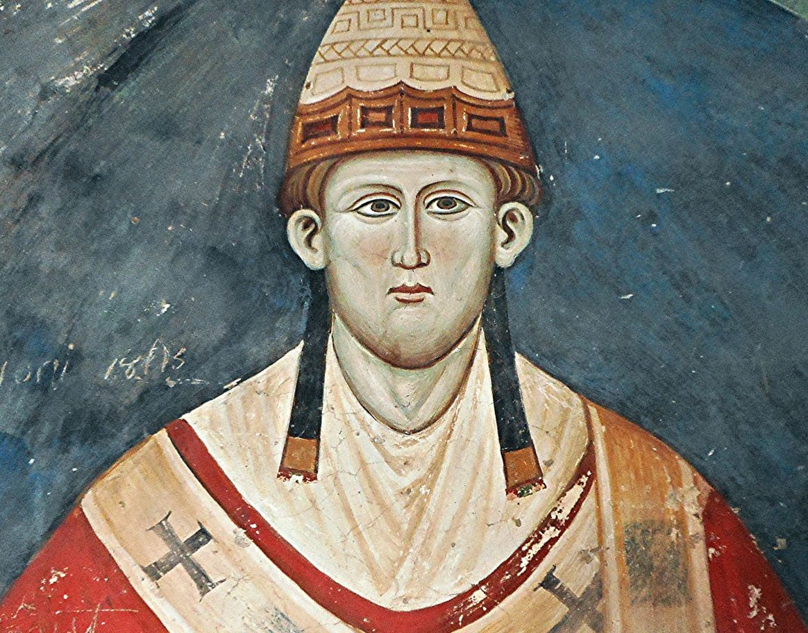 Craftsman preforming white transparent gemstone into the oval cabochon form