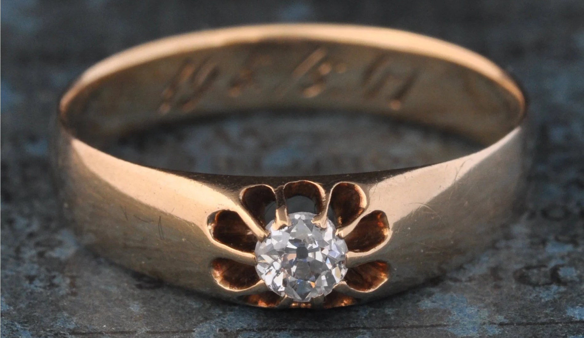 A couple enjoying a drink and stroking a dog