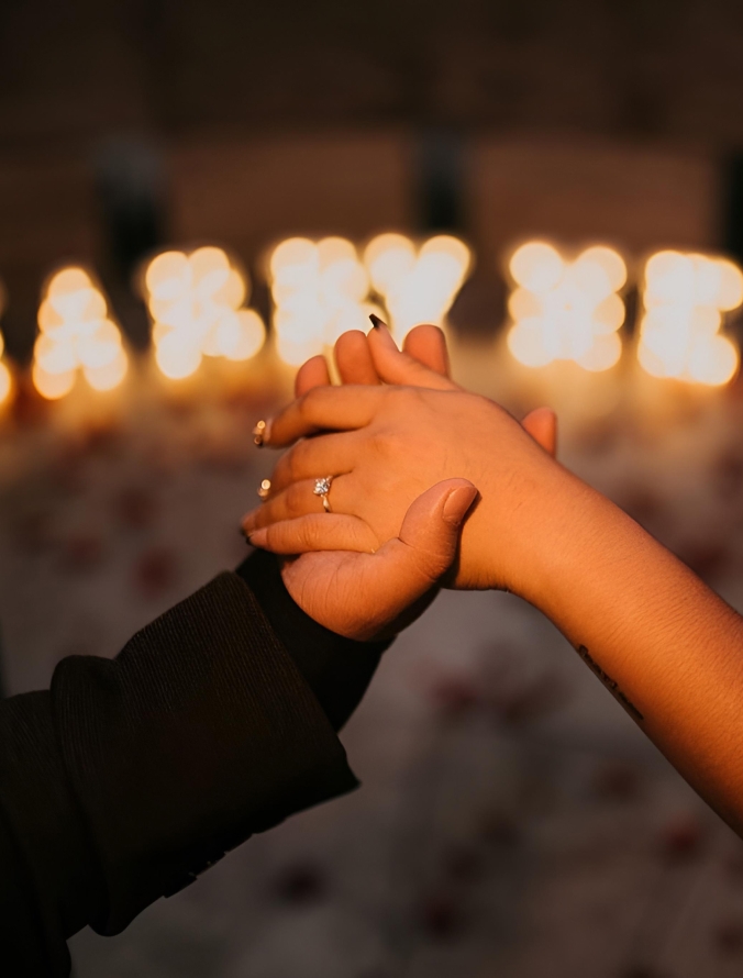 Craftsman appraising faceted gemstone with eyepiece