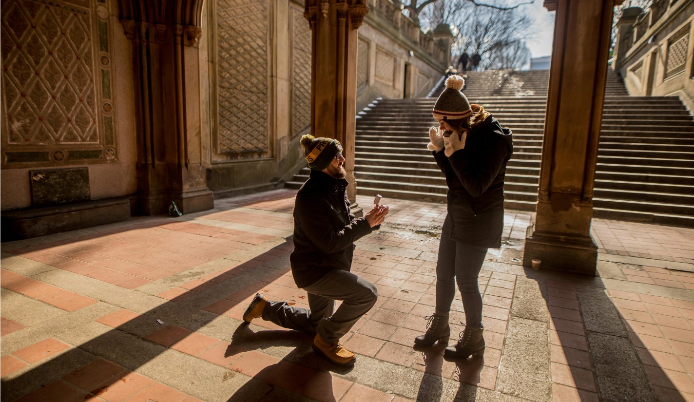 Proposal outside at the bottom of a set of stairs
