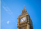 Upward view of the Elizabeth Tower (Big Ben) in London against a clear blue sky