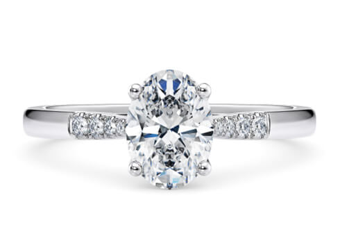 Thea in White Gold set with a Oval cut diamond.