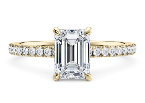 Aria in Yellow Gold set with a Emerald cut diamond.