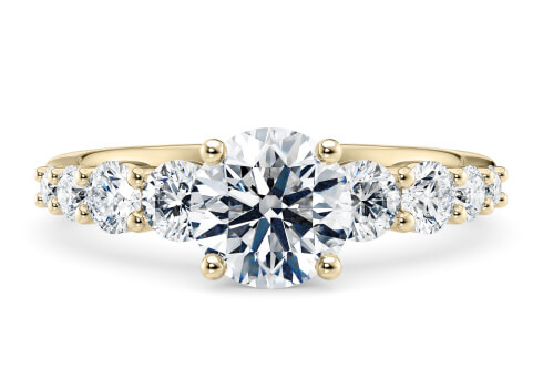 Lyra in Yellow Gold set with a Round cut diamond.