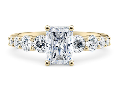 Lyra in Yellow Gold set with a Radiant cut diamond.
