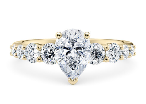 Lyra in Yellow Gold set with a Pear cut diamond.