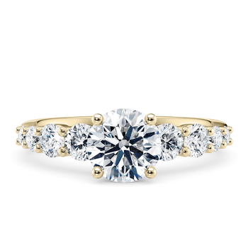 Lyra in Yellow Gold set with a Round cut diamond.