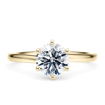 Zeta in Oro amarillo (9k) set with a Redondo cut diamante.