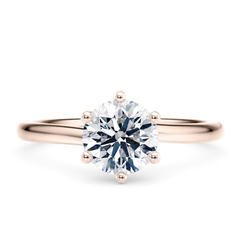 Zeta in Or rose set with a Taille ronde cut diamant.