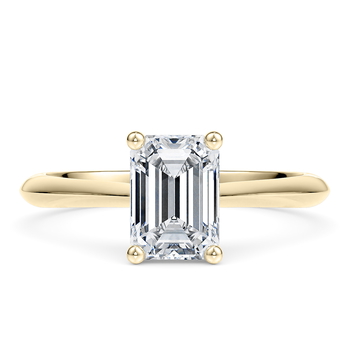 Iris in Oro giallo (9k) set with a Smeraldo cut diamante.