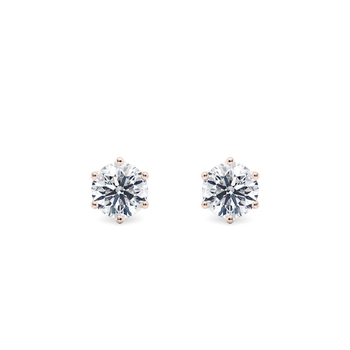 Dahlia in Aur Roz set with a Rotund cut diamant.