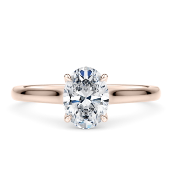Amara in Aur Roz set with a Oval cut diamant.
