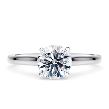 Amara in Oro Blanco set with a Redondo cut diamante.