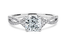 Lola in Platinum set with a Cushion cut diamond.