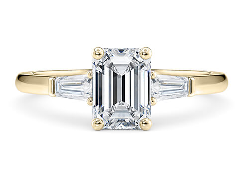 Alexandria in Yellow Gold set with a Emerald cut diamond.