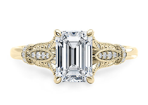 Jasmine in Yellow Gold set with a Emerald cut diamond.