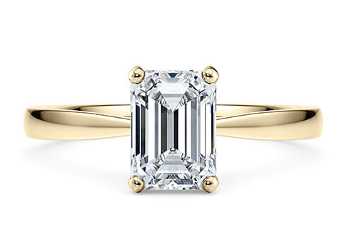 Delicacy in Yellow Gold set with a Emerald cut diamond.
