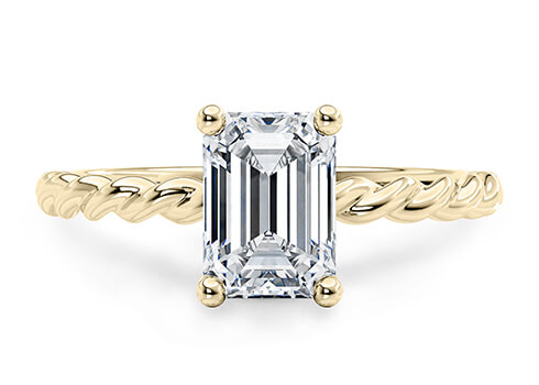 Ascot in Oro Amarillo set with a Esmeralda cut diamante.