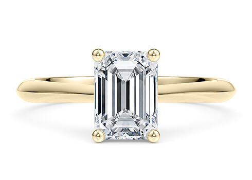 Iris in Gelbgold set with a Smaragd cut diamant.