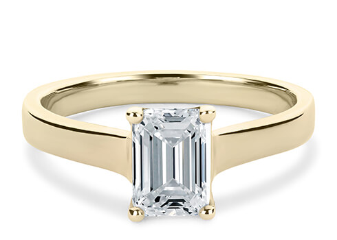 Ballerina in Yellow Gold set with a Emerald cut diamond.