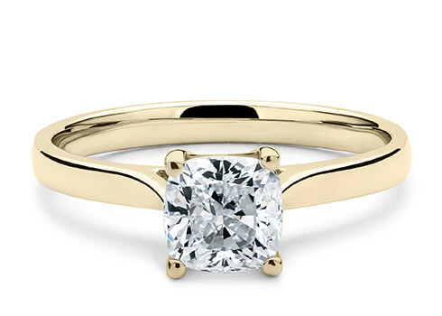 Contour in Yellow Gold set with a Cushion cut diamond.