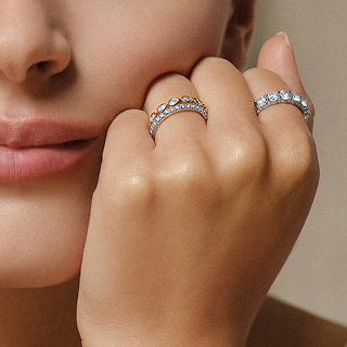Woman wearing two diamond eternity rings