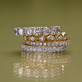 Stack of white and yellow gold diamond eternity rings